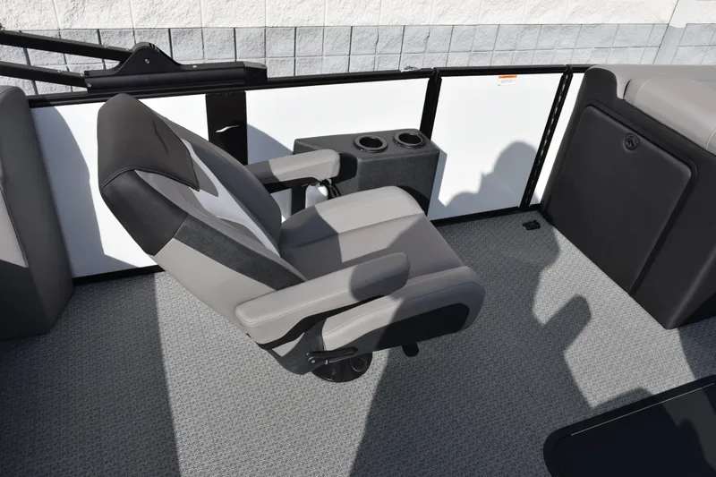 Slide: The Image of Captain's chair on 2026 Evotti 523CS boat, featuring cup holders and modern design. - 10