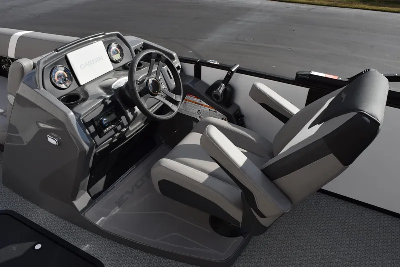 Slide: The Image of 2026 Evotti 523CS boat cockpit with steering wheel and Garmin display. - 11
