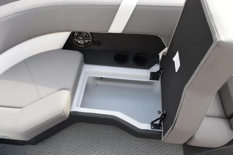 Slide: The Image of Interior storage compartment of 2026 Evotti 523CS boat with gray seating and cup holders. - 18