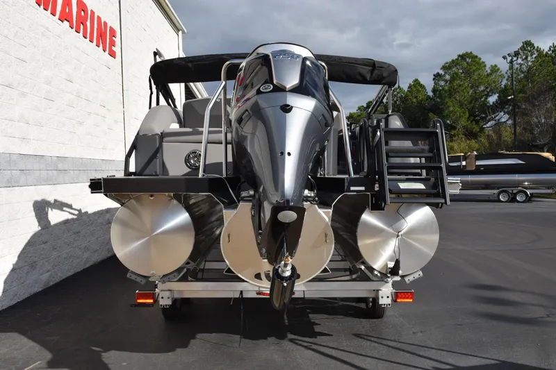 Slide: The Image of 2026 Evotti 523CS pontoon boat with powerful outboard motor, parked outdoors. - 5