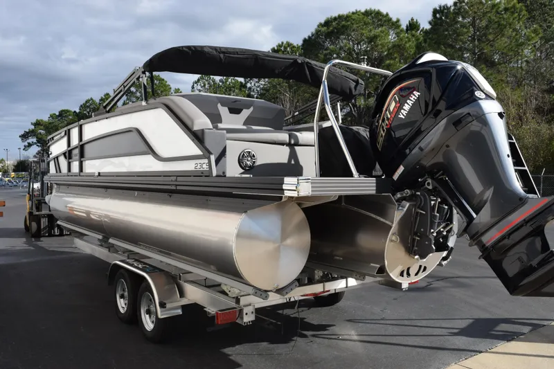 Slide: The Image of 2026 Evotti 523CS pontoon boat on trailer with Yamaha outboard motor. - 6