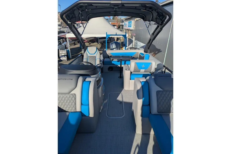Slide: The Image of 2026 Berkshire 23SB2 STS pontoon boat interior with blue and gray seating. - 7