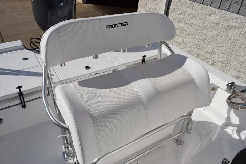 Slide: The Image of 2026 Frontier 2104 boat seat with white upholstery and stainless steel frame. - 10