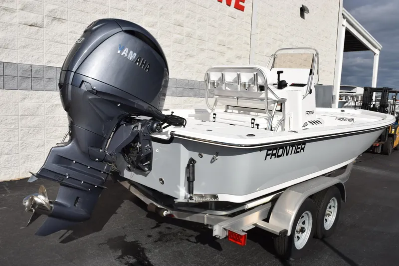 Slide: The Image of 2026 Frontier 2104 boat with Yamaha outboard motor on a trailer. - 4