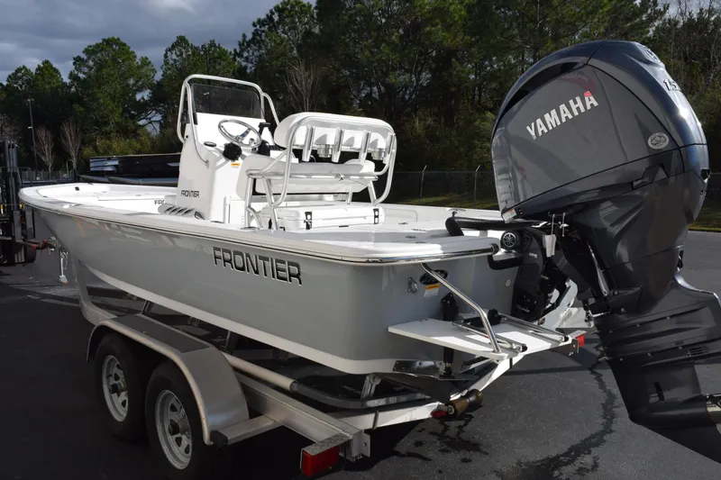 Slide: The Image of 2026 Frontier 2104 boat with Yamaha engine on a trailer. - 6