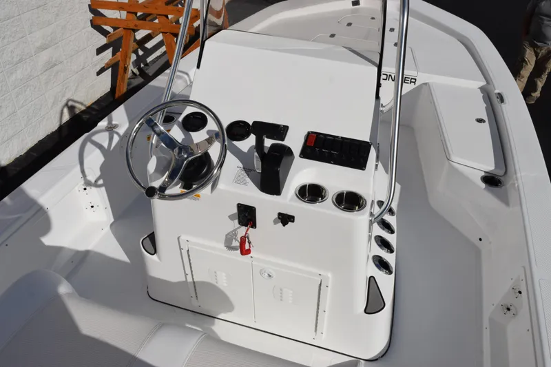 Slide: The Image of 2026 Frontier 2104 boat console with steering wheel and control panel. - 9