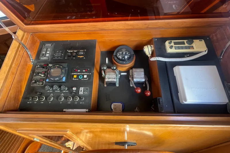 Slide: The Image of 1990 Spindrift Cockpit Motoryacht control panel with navigation instruments and communication equipment. - 40