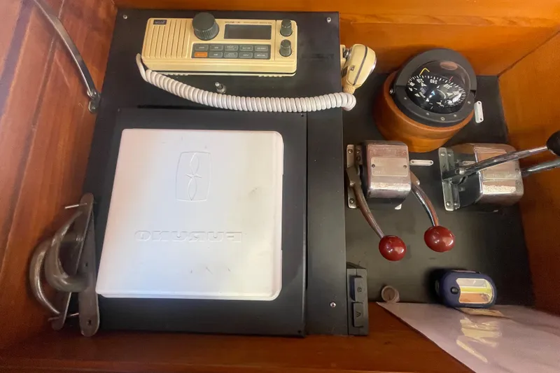 Slide: The Image of Control panel of a 1990 Spindrift COCKPIT MOTORYACHT with navigation and communication equipment. - 42