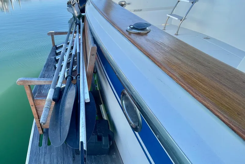 Slide: The Image of 1990 Spindrift COCKPIT MOTORYACHT with oars and wooden deck detail. - 8