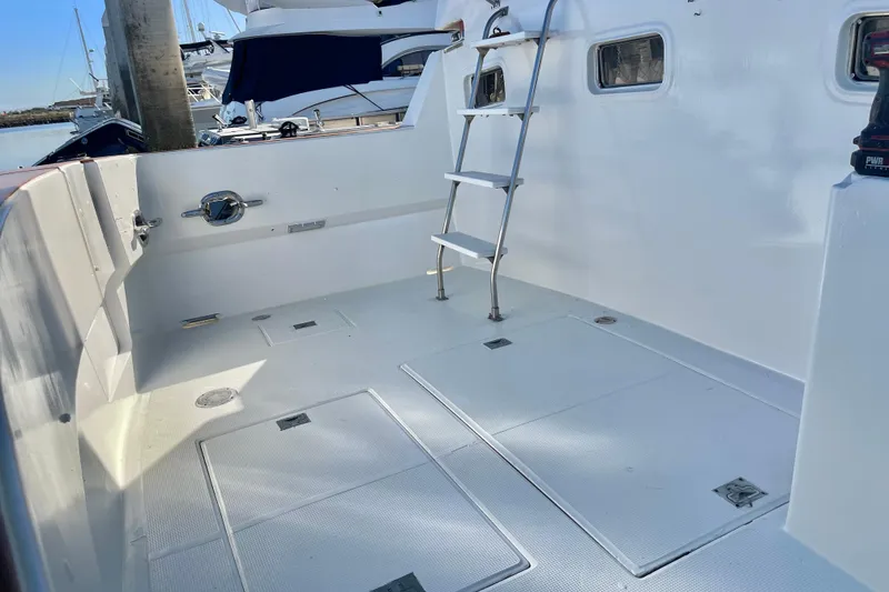 Slide: The Image of 1990 Spindrift COCKPIT MOTORYACHT interior with ladder and clean white deck. - 9