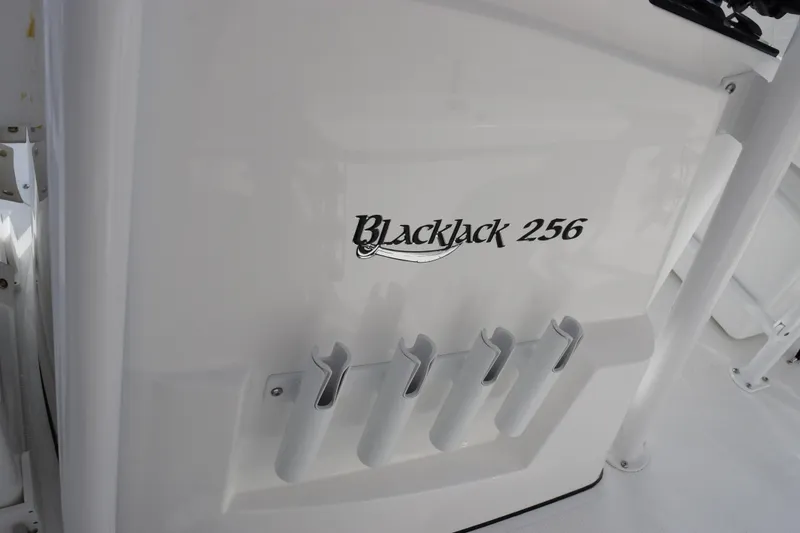 Slide: The Image of 2026 BlackJack 256 Bay boat with rod holders and sleek design. - 17