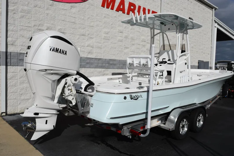 Slide: The Image of 2026 BlackJack 256 Bay boat with Yamaha engine on trailer. - 4