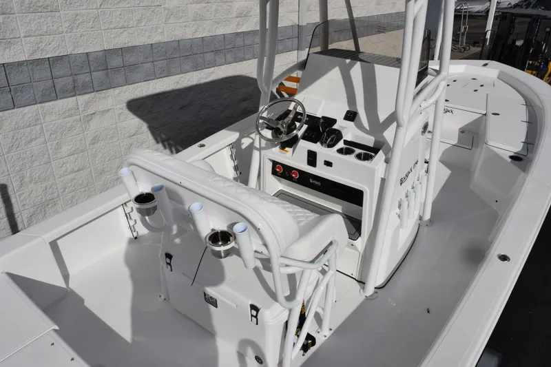 Slide: The Image of 2026 BlackJack 256 Bay boat interior with steering console and seating. - 7