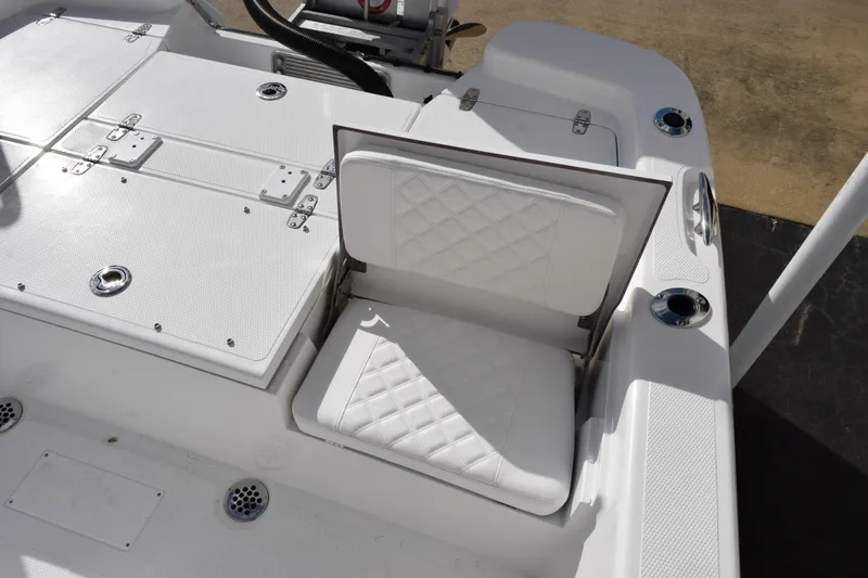 Slide: The Image of 2026 BlackJack 256 Bay boat with white quilted seating and storage compartments. - 8