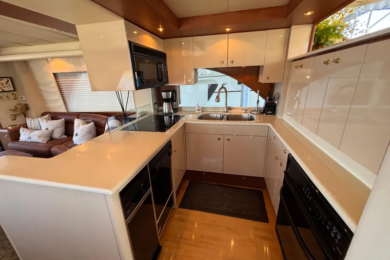 Slide: The Image of Luxurious 1996 Queenship yacht kitchen with modern appliances and elegant cabinetry. - 18