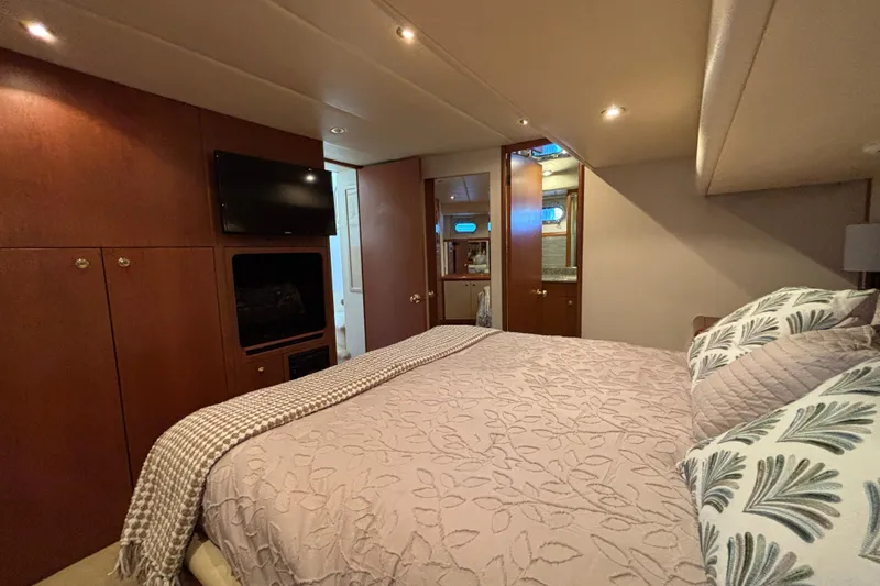 Slide: The Image of Luxurious 1996 Queenship yacht bedroom with elegant bedding and modern amenities. - 7
