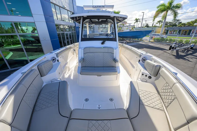 Slide: The Image of 2023 Pursuit S 328 Sport boat interior with luxurious seating and modern design. - 24