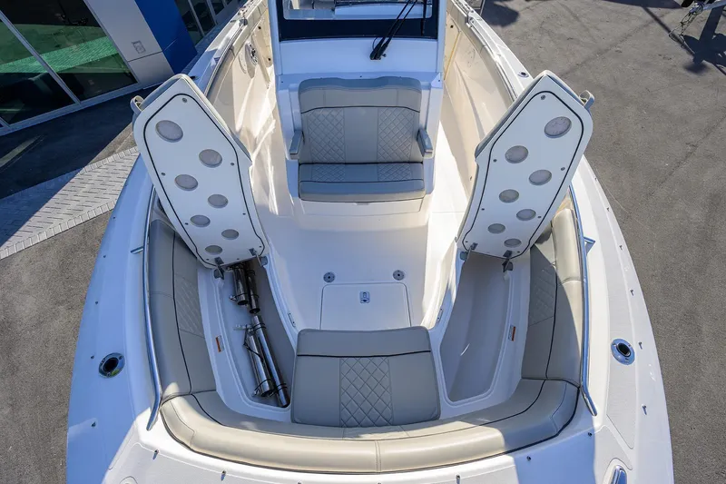 Slide: The Image of 2023 Pursuit S 328 Sport boat interior with open storage compartments. - 26