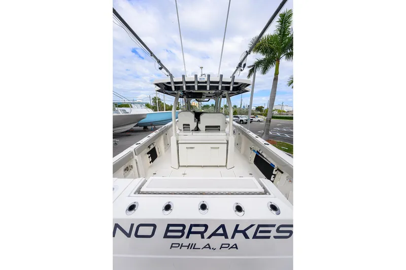 Slide: The Image of 2023 Pursuit S 328 Sport boat interior, featuring spacious deck and seating, docked in Philadelphia. - 39