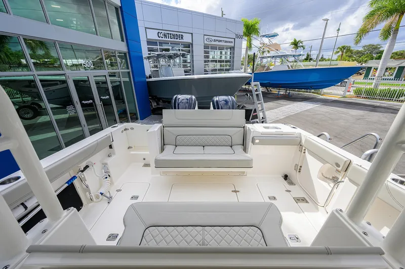Slide: The Image of 2023 Pursuit S 328 Sport boat interior at dealership, featuring spacious seating and modern design. - 43