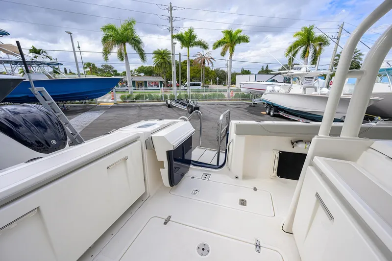 Slide: The Image of 2023 Pursuit S 328 Sport boat interior with open deck and storage compartments. - 54