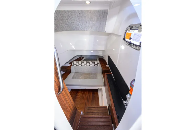 Slide: The Image of 2023 Pursuit S 328 Sport cabin interior with wood flooring and modern design. - 60