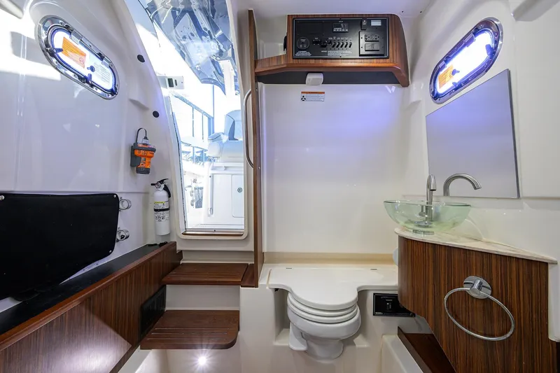 Slide: The Image of 2023 Pursuit S 328 Sport boat interior with modern bathroom amenities. - 65