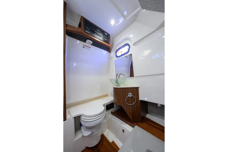 Slide: The Image of 2023 Pursuit S 328 Sport boat interior with modern bathroom amenities. - 66