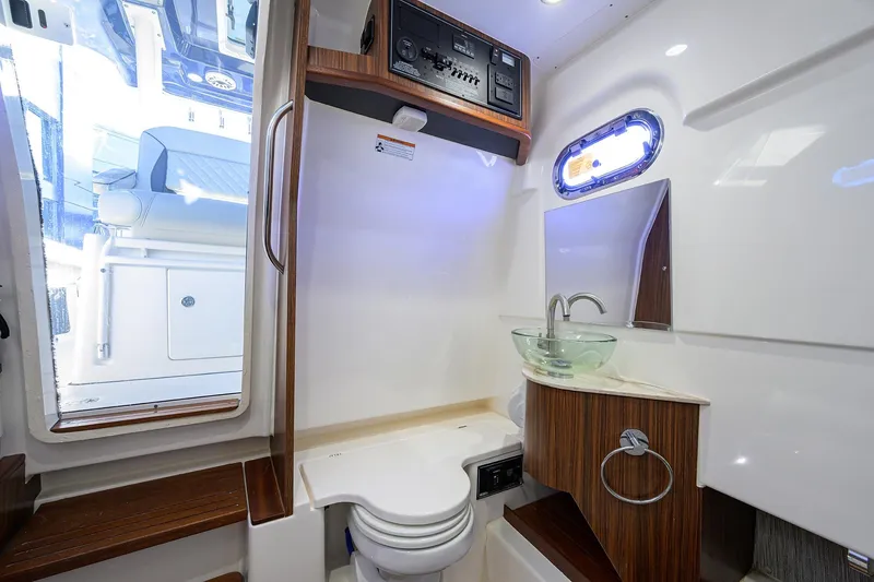 Slide: The Image of 2023 Pursuit S 328 Sport boat interior with modern bathroom amenities. - 67