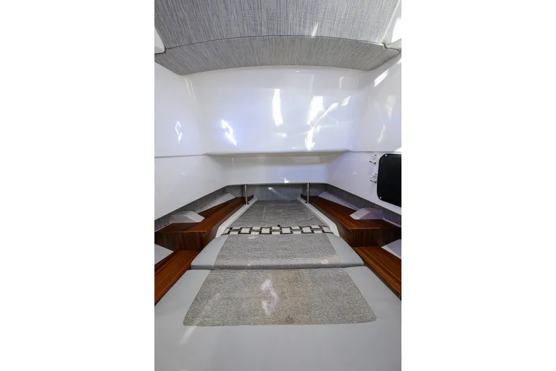 Slide: The Image of 2023 Pursuit S 328 Sport cabin interior with modern design and wood accents. - 70