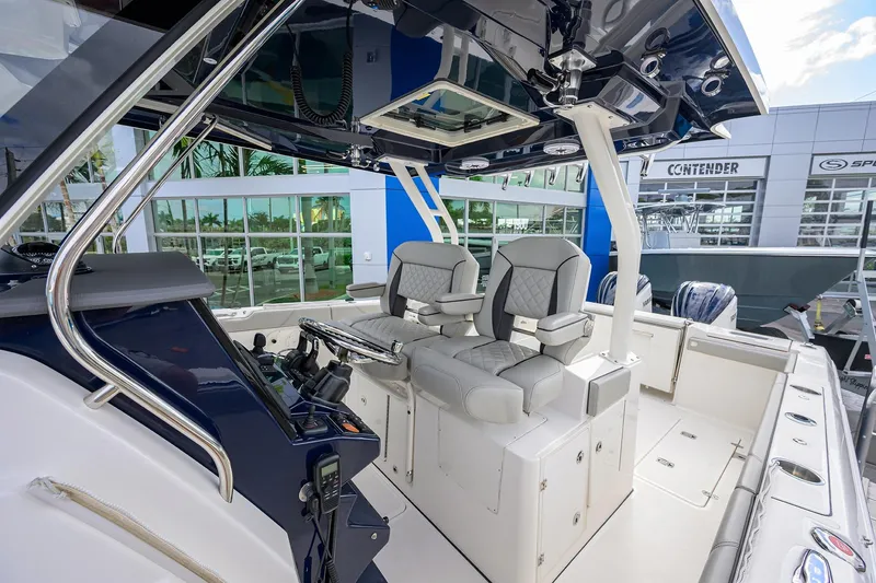 Slide: The Image of 2023 Pursuit S 328 Sport boat interior with dual seats and control panel. - 8