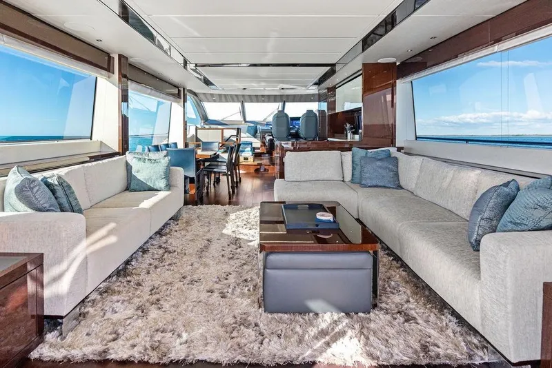 Slide: The Image of Luxurious interior of 2019 Sunseeker 76 Yacht with elegant seating and ocean views. - 10