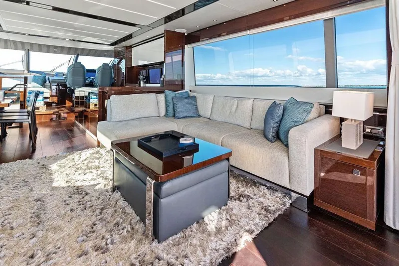 Slide: The Image of Luxurious interior of 2019 Sunseeker 76 Yacht with plush seating and panoramic windows. - 11