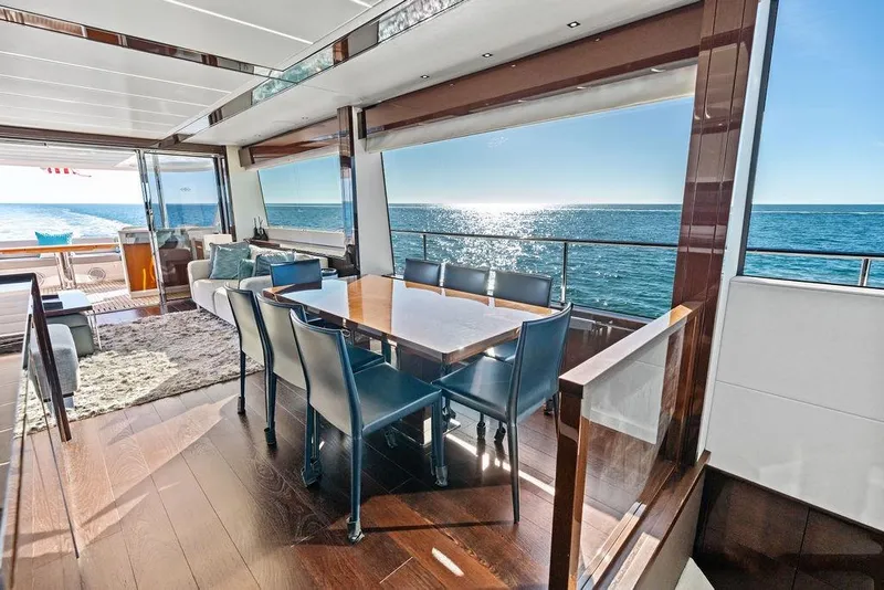 Slide: The Image of Luxurious interior of 2019 Sunseeker 76 Yacht with ocean view and elegant dining area. - 13