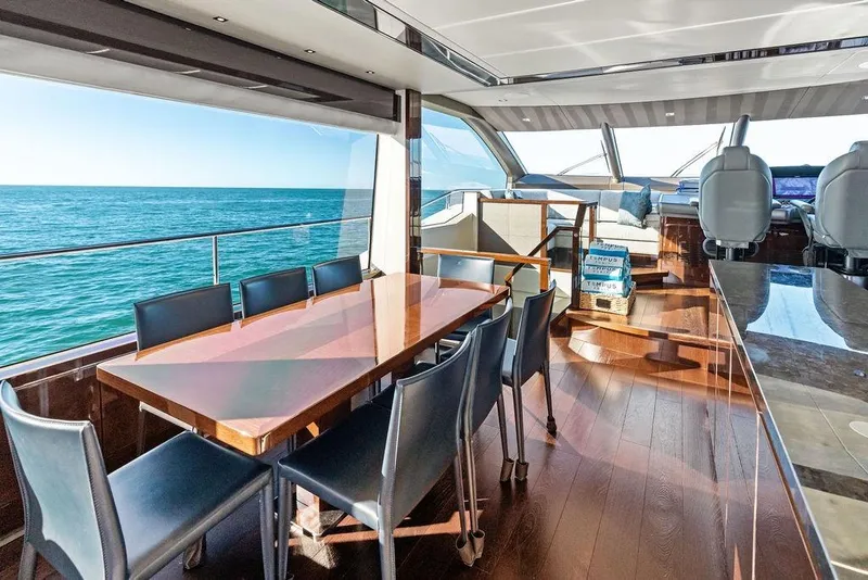 Slide: The Image of Luxurious interior of 2019 Sunseeker 76 Yacht with ocean view and elegant dining area. - 14