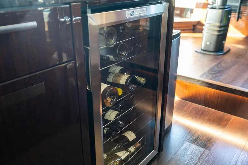 Slide: The Image of Wine cooler on 2019 Sunseeker 76 Yacht with wooden interior flooring. - 17