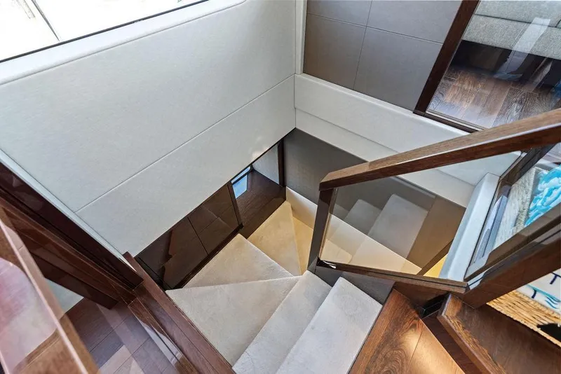 Slide: The Image of Staircase inside 2019 Sunseeker 76 Yacht with elegant wood and glass design. - 18