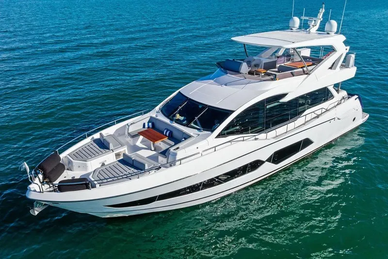 Slide: The Image of Luxurious 2019 Sunseeker 76 Yacht cruising on clear blue waters. - 2