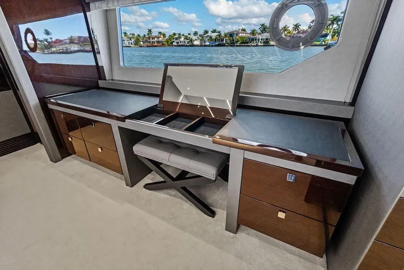 Slide: The Image of Luxurious interior of 2019 Sunseeker 76 Yacht with elegant desk and waterfront view. - 21
