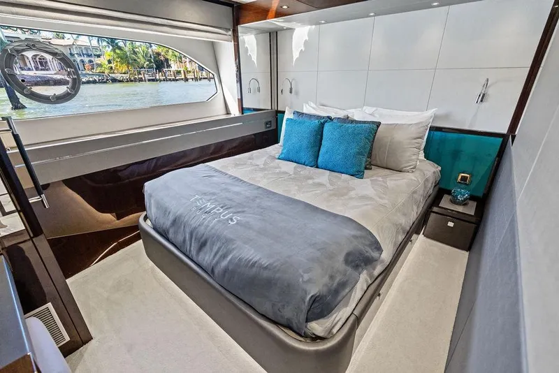 Slide: The Image of Luxurious bedroom interior of 2019 Sunseeker 76 Yacht with elegant bedding and waterfront view. - 23