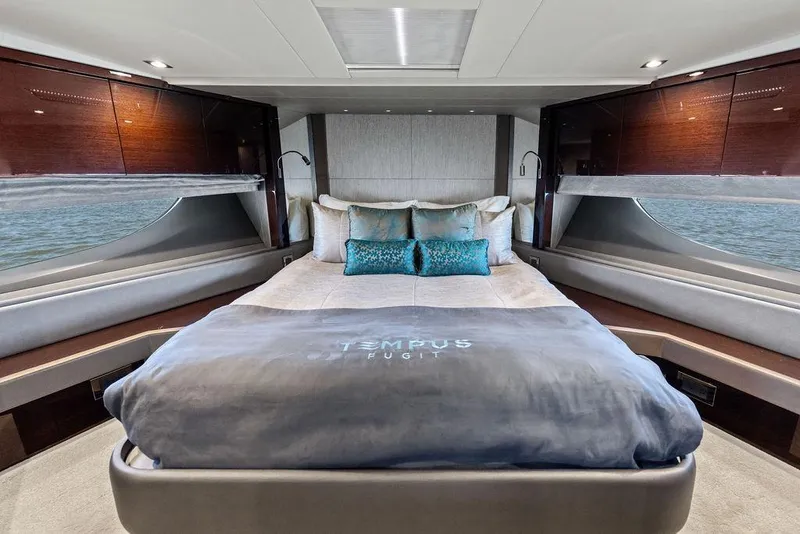 Slide: The Image of Luxurious bedroom interior of 2019 Sunseeker 76 Yacht with elegant bedding and panoramic windows. - 27