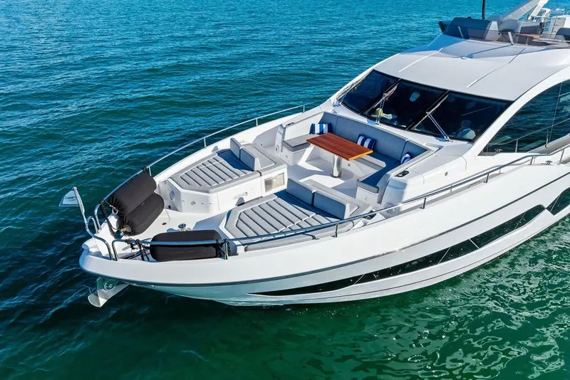 Slide: The Image of 2019 Sunseeker 76 Yacht cruising on clear blue waters. - 3