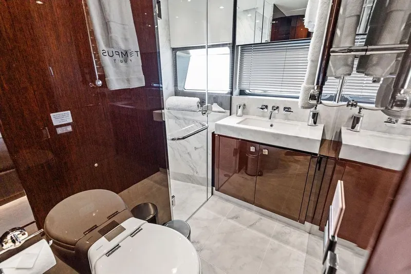 Slide: The Image of Luxurious bathroom in a 2019 Sunseeker 76 Yacht, featuring elegant fixtures and modern design. - 32