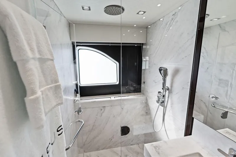 Slide: The Image of Luxurious marble bathroom in 2019 Sunseeker 76 Yacht, featuring modern shower and window. - 35