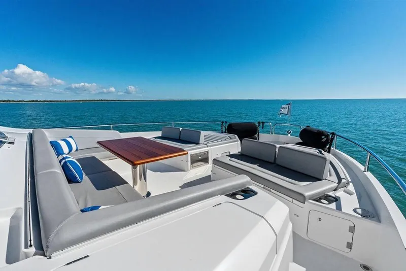 Slide: The Image of Luxurious 2019 Sunseeker 76 Yacht deck with seating, table, and ocean view. - 39