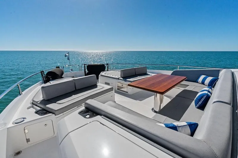 Slide: The Image of Luxurious 2019 Sunseeker 76 Yacht deck with seating, table, and ocean view. - 40