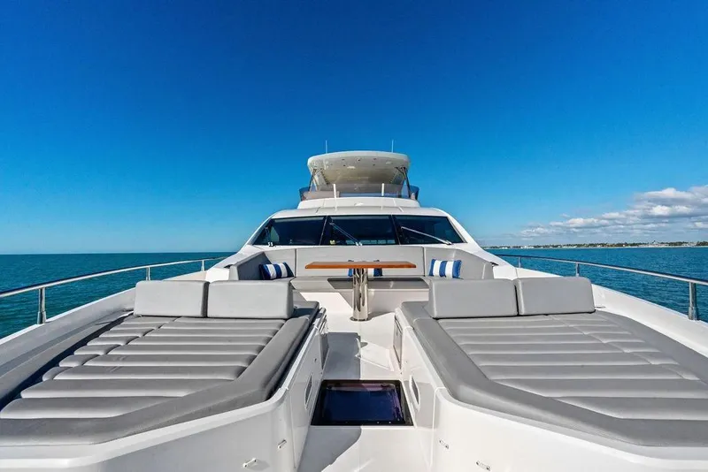 Slide: The Image of Luxurious 2019 Sunseeker 76 Yacht with sun loungers on open sea. - 41
