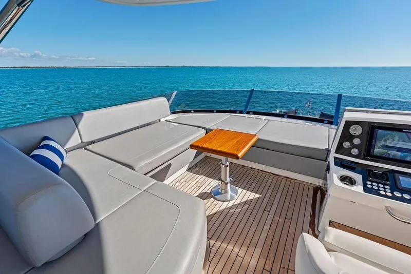 Slide: The Image of Luxurious 2019 Sunseeker 76 Yacht deck with seating, table, and ocean view. - 45