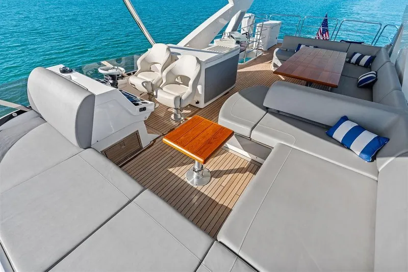 Slide: The Image of Luxurious 2019 Sunseeker 76 Yacht deck with plush seating and ocean view. - 47