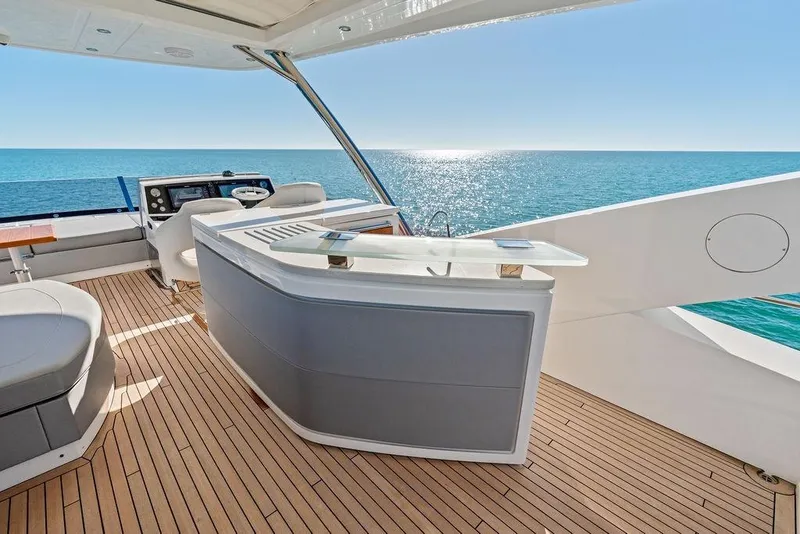 Slide: The Image of Luxurious 2019 Sunseeker 76 Yacht deck with ocean view and modern amenities. - 48